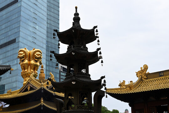 Ancient chinese temple against a modern skyscraper