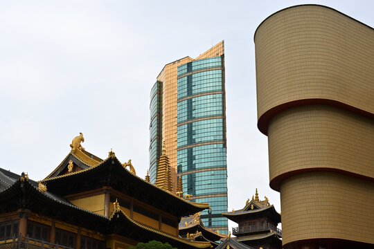 Ancient chinese temple against a modern skyscraper