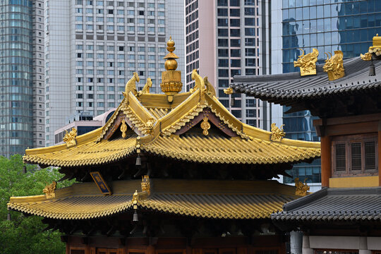 Ancient chinese temple against a modern skyscraper