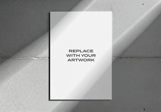 Vertical poster mockup displayed on a concrete wall, minimalist graphic design presentation with natural light and shadows, blank artwork placeholder for branding or print display
