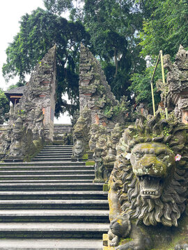 May 25, 2026 - Ubud, Bali, Indonesia: Pura Dalem temple entrance with Candi Bentar gate, stairs, and lion statues