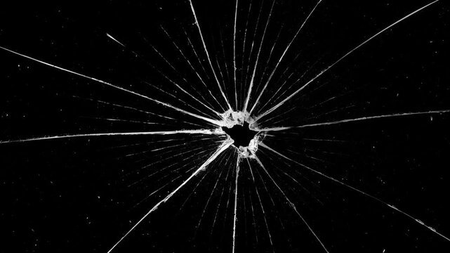 Broken cracks glass fracture effect texture isolated abstract black background. Cracked glass fracture effect on black background. Broken glass on black background. Glass is breaking. 