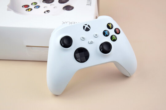 The white Xbox controller on the beige background.