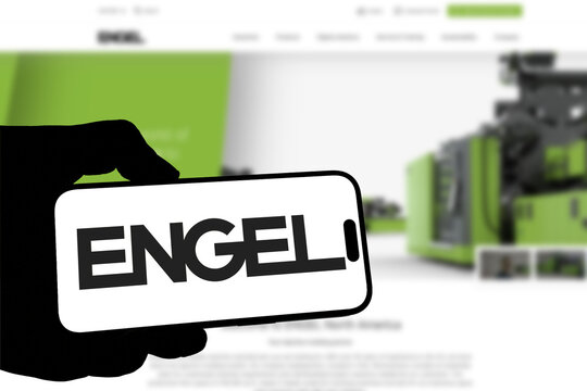 Kiel, Germany - 08-19-2026: Smartphone displaying Austrian industrial machinery manufacturer ENGEL logo in front of companys webpage
