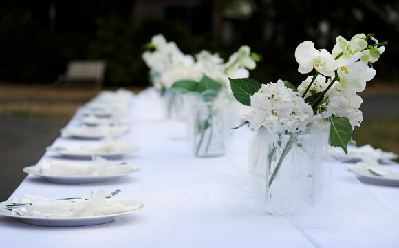Table decoration and flowers at an outdoor wedding