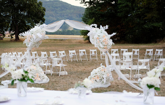 Table decoration and flowers at an outdoor wedding