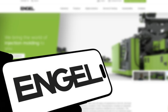 Kiel, Germany - 08-19-2026: Smartphone displaying Austrian industrial machinery manufacturer ENGEL logo in front of companys webpage