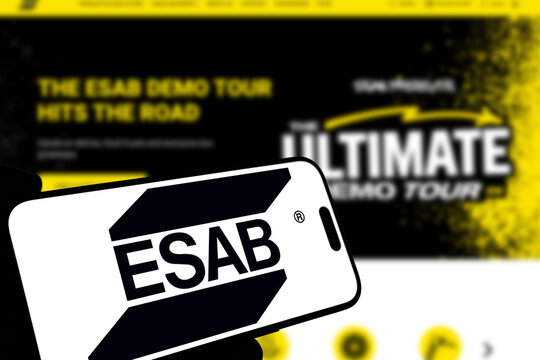 Kiel, Germany - 08-19-2026: Smartphone displaying US welding equipment manufacturer ESAB logo in front of companys webpage