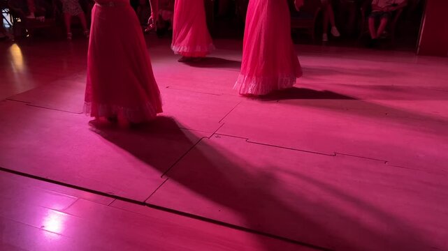 Horizontal video of women's legs dancing flamenco with swirling skirts