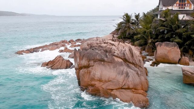 Anse Patates at La Digue, Seychelles. Small and beautiful beach, surrounded by granite boulders and coconut palms