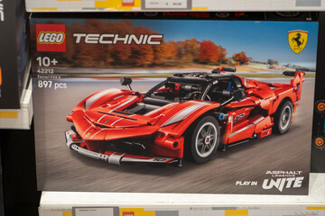 Fototapeta premium LEGO Technic Ferrari FXX K Red Racing Sports Car Building Blocks Model Toy Set Box on a Retail Shelf. Milan, Italy - June 24, 2026