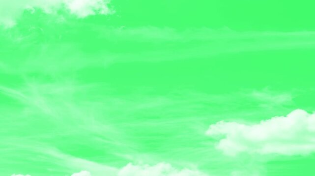 Puffy fluffy white cloud n cotton candy cumulus cloudscape moving, White fluffy clouds on a green screen. Moving clouds motion graphic effects on green screen background. blue sky with white clouds,