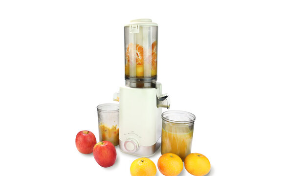Modern juicer or juice extractor for juice or slow juice for extracting fresh fruit juice from apples and oranges featuring compact design clear containers and fresh ingredients for healthy nutrition