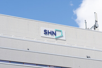 Fototapeta premium Toronto, ON, Canada - August 17, 2026: The Scarborough Health Network (SHN) sign on the building in Scarborough, Toronto, ON, Canada. SHN is a major hospital network serving Scarborough in Toronto. 