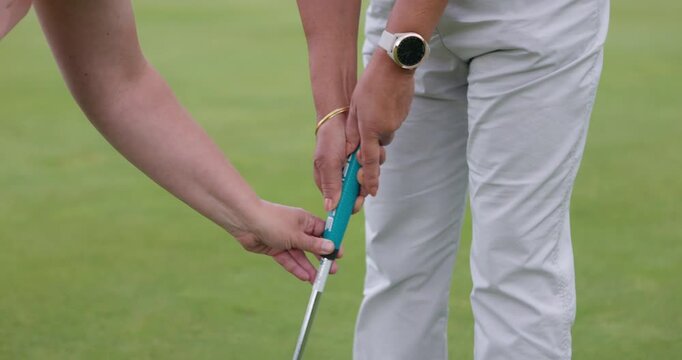 Sport, coach and woman training in golf on course for development in stroke and swing of club. Hands, closeup and mentor holding stick for player, athlete and student learning on pitch in sports game