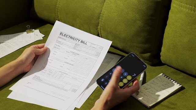 Woman Reviewing Rising Household Expenses and Monthly Budget, Calculate Utility Bills By Using Smart Phone