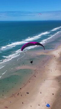 Paraglider In Fortaleza Ceara Brazil. Bird Eye View Of Stunning Parasailing Scene Over A Blue Ocean. Tropical Skyline. Bay Water Landscape. Fortaleza Ceara.