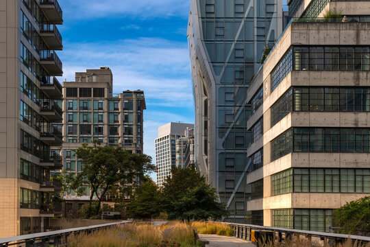 The elevated walkway of High Line Park offers a unique perspective of the innovative modern architecture found throughout the Chelsea neighborhood located in Manhattan.