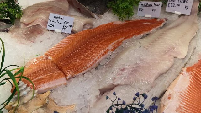Fresh raw fish and seafood on ice at a market stall