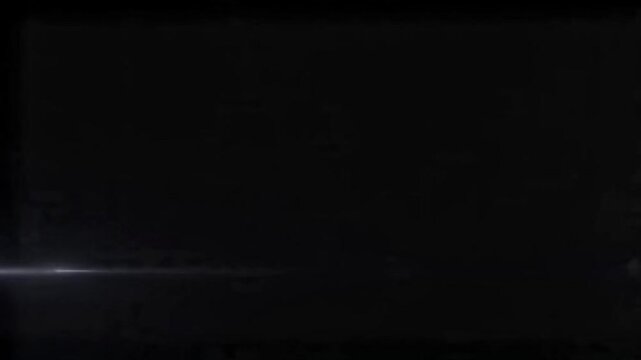 A simple black silhouette of a cute dog standing on four legs in profile