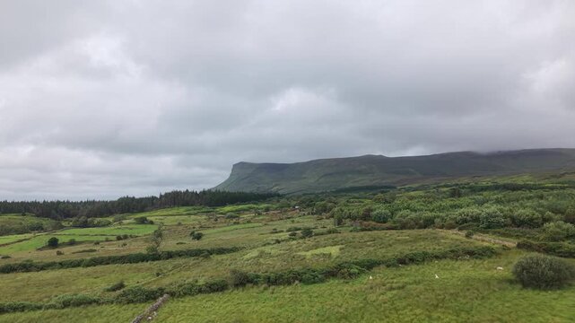 Benbulben Beneath Low Clouds Across Green Sligo Countryside in Ireland
