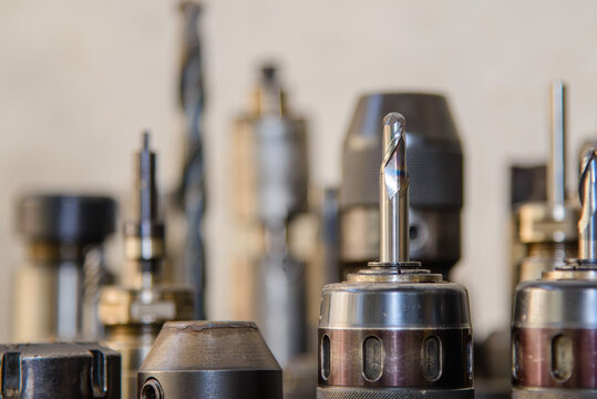 Close up of used ball nose end mill tool setup on CNC milling machine spindle