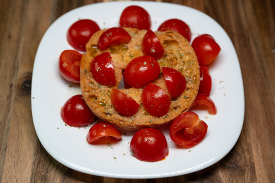 Fresella with cherry tomatoes, oregano, and extra virgin olive.