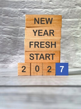 Wooden blocks displaying &ldquo;New Year Fresh Start&rdquo; and 2027, symbolizing new beginnings, personal goals, renewal and a fresh start.