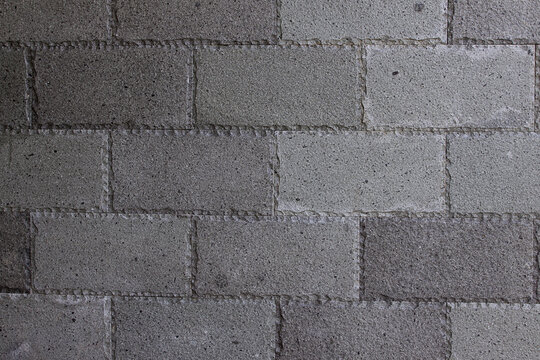 Gray Concrete Cinder Block Wall Texture Background With Rough Masonry Pattern For Design