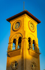 Naklejka premium Beale Memorial Clock Tower glows at sunset
