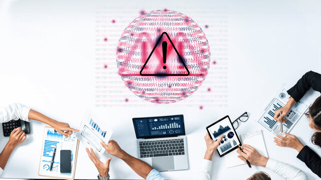 A diverse team works together in a modern office setting, analyzing data and discussing strategies while a warning symbol signifies important security concerns. Gantry