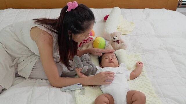 Mother Tender Touch: A moment of maternal bliss as a mother gently interacts with her newborn baby, creating a tender atmosphere of love and care.