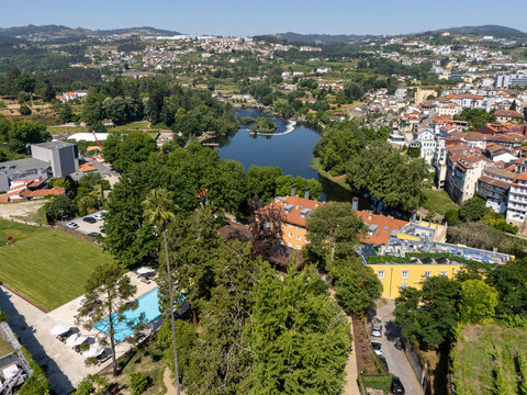Aerial view of Casa da Calcada garden pool and Tamega River weir in Amarante