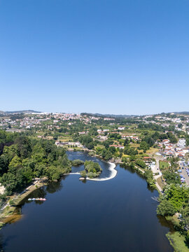 Aerial vertical view of Tamega River dam weir and park in Amarante Portugal