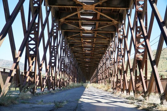 Interior view of the old rusty iron Pocinho railway bridge over Douro River in Portugal