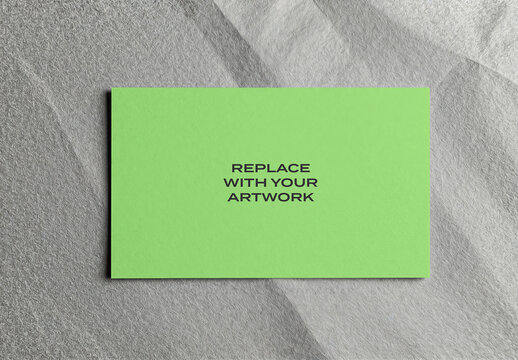 Business card mockup with placeholder text on a textured gray background, stationery branding presentation, print template for graphic design, flat lay desk surface