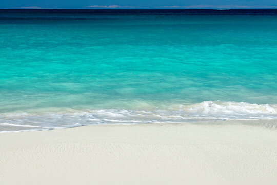 Front view of blue transparent water and perfect white sand in Shoal Bay beach, Caribbean dream background in Anguilla island, British West Indies