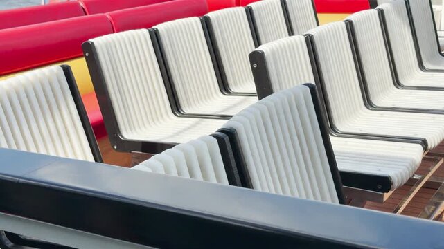 Empty seats wait quietly on a river cruise boat deck in Saint Petersburg. The neat, bright setup creates a peaceful and cheerful feeling of anticipation for a journey.