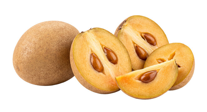Fresh sapodilla fruits whole and halved showing brown seeds and orange flesh.