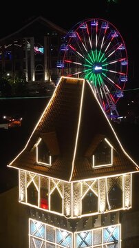 Capivari Village In Campos Do Jordao Sao Paulo Brazil. Bird Eye View Of Stunning Ferris Wheel In A Amusement Park. Night Downtown Cityscape. Cities Of The World. Campos do Jordao Sao Paulo.