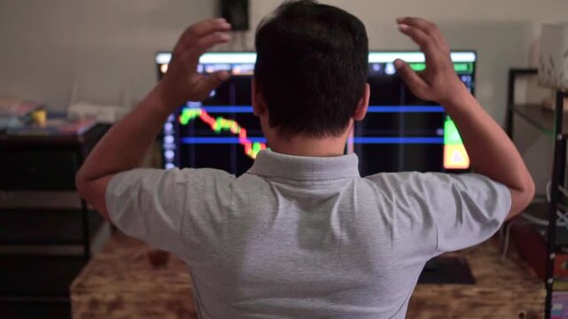 Trader from behind analyzing forex trading chart on monitor, buy and sell buttons visible, investment decision making and financial market concept.