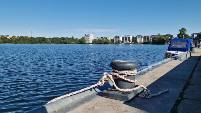 Mooring bollard and ropes on Ziegelinnensee in Schwerin, Germany