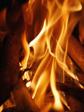 Close up of a fire with the flames reaching up to the top of the image