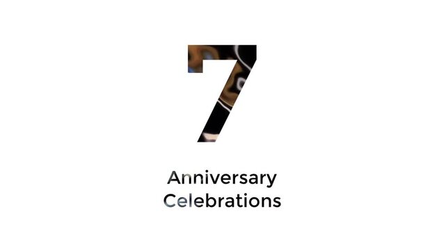 7th anniversary celebration with abstract black, yellow, white and blue color animation on white background
