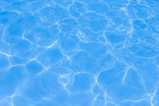 The light reflects blue in the water in the swimming pool. It looks fresh and lively, suitable for use as a wallpaper.