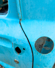 Bright blue dilapidated old pickup truck with gas cap and handle missing  © Craig Taylor Photo