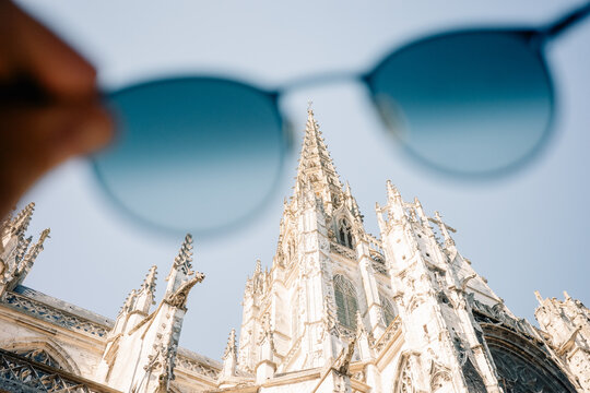 View of a Tall Church Building Through Blue Sunglasses in the Sun