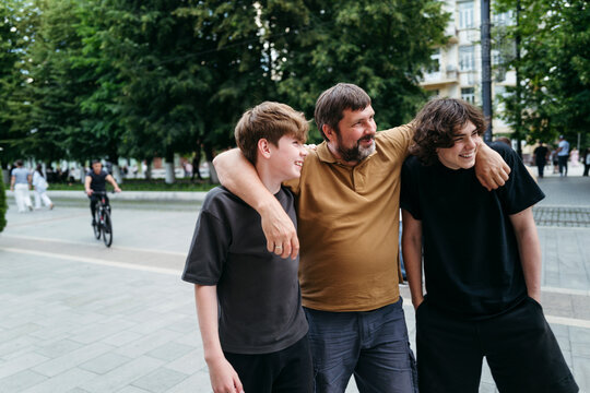 Joyful moments shared between Family Members in a Busy Park