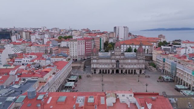Aerial view flying towards a coruna city hall square