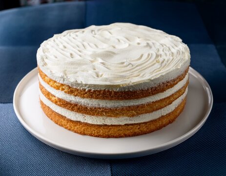 delicious layered cake with white frosting perfect for celebrations and desserts showcasing a delightful and tempting treat